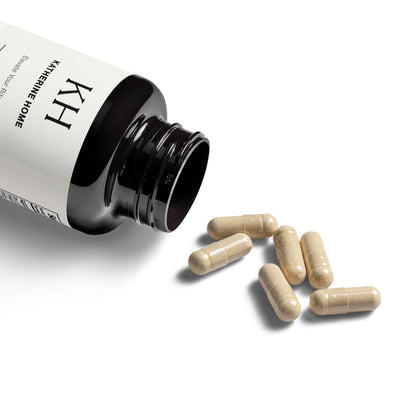 Lifestyle image showing the supplement bottle with capsules.