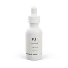 Front view of Katherine Home Snail Mucin Facial Serum in white 1 oz dropper bottle